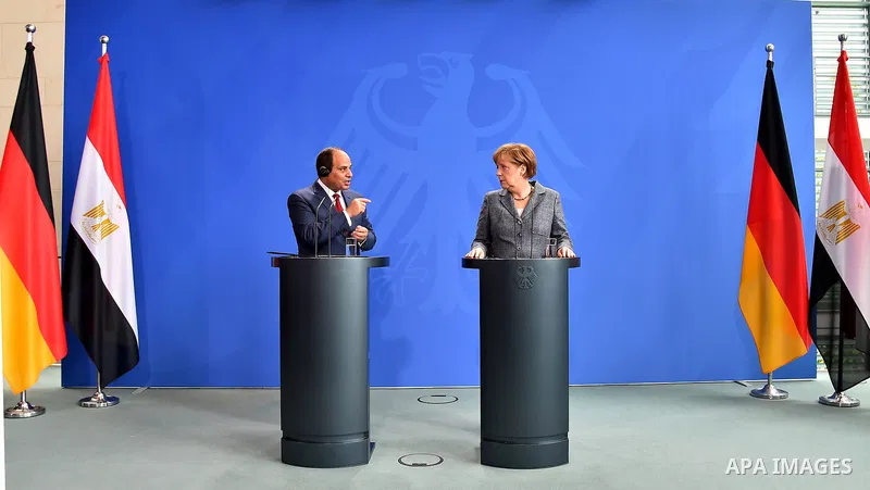 German Chancellor Angela Merkel and Egyptian President Abdel Fattah al-Sisi shake hands attend a press conference on June 3, 2015 at the Chancellery in Berlin. Photo by Egyptian Presidency