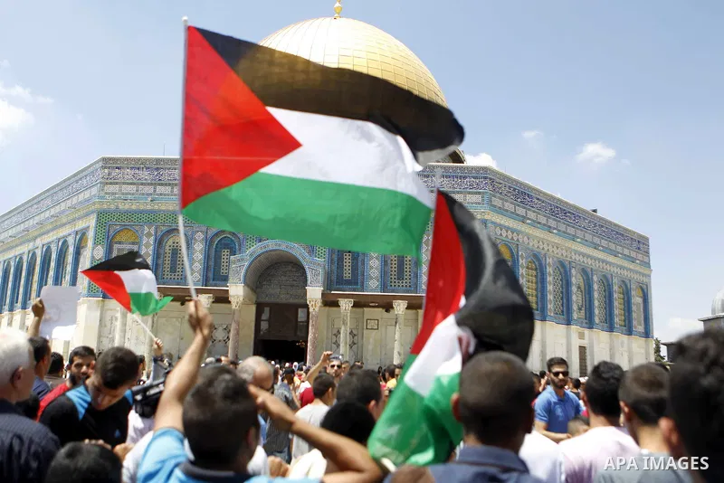 Protestors shout slogans during a demonstration in support of Palestinian Khader Adnan, a senior member of Islamic Jihad who is jailed in Israel without a trial, at the Al-Aqsa mosque in the old city of Jerusalem on June...