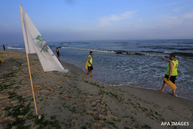 Palestinian boys take part in a training camps of the swimming organized by the Hamas movement into the Mediterranean Sea in Gaza City, on June 6, 2015. Photo by Mohammed Asad