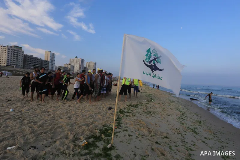Palestinian boys take part in a training camps of the swimming organized by the Hamas movement into the Mediterranean Sea in Gaza City, on June 6, 2015. Photo by Mohammed Asad