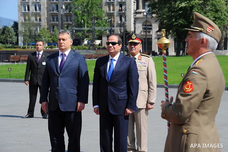 Egyptian President Abdel Fattah al-Sisi and Hungarian Prime Minister Viktor Orban inspect the honour guard in front of the parliament building in Budapest on June 5, 2015 during his welcoming ceremony. The Egyptian guest...
