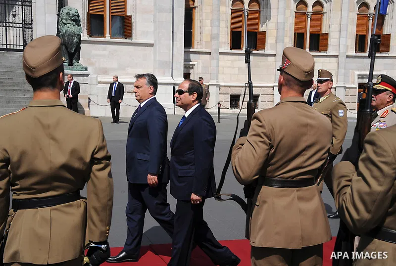Egyptian President Abdel Fattah al-Sisi and Hungarian Prime Minister Viktor Orban inspect the honour guard in front of the parliament building in Budapest on June 5, 2015 during his welcoming ceremony. The Egyptian guest...