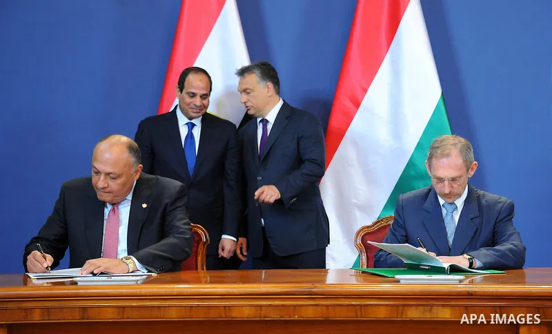 Egyptian President Abdel Fattah al-Sisi and Hungarian Prime Minister Viktor Orban inspect the honour guard in front of the parliament building in Budapest on June 5, 2015 during his welcoming ceremony. The Egyptian guest...