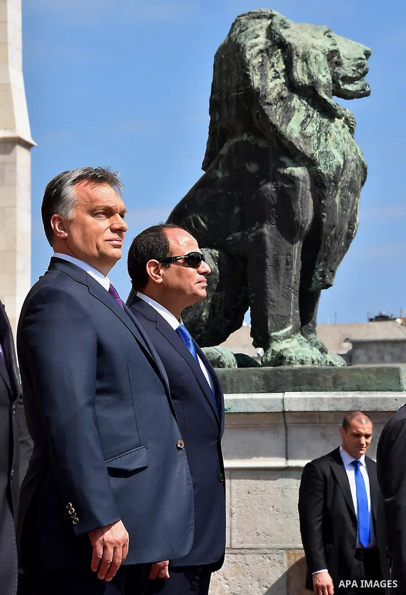Egyptian President Abdel Fattah al-Sisi and Hungarian Prime Minister Viktor Orban inspect the honour guard in front of the parliament building in Budapest on June 5, 2015 during his welcoming ceremony. The Egyptian guest...