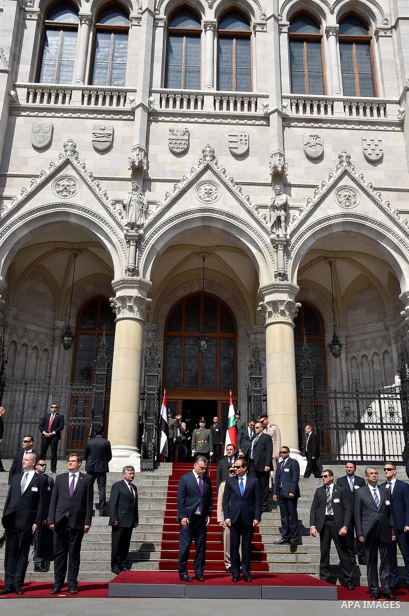 Egyptian President Abdel Fattah al-Sisi and Hungarian Prime Minister Viktor Orban inspect the honour guard in front of the parliament building in Budapest on June 5, 2015 during his welcoming ceremony. The Egyptian guest...