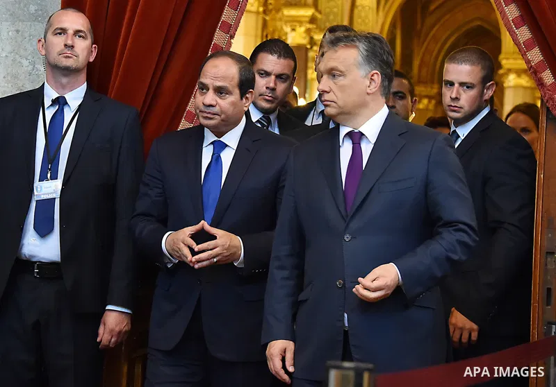 Egyptian President Abdel Fattah al-Sisi and Hungarian Prime Minister Viktor Orban inspect the honour guard in front of the parliament building in Budapest on June 5, 2015 during his welcoming ceremony. The Egyptian guest...