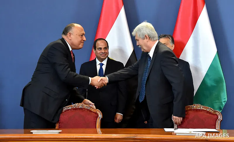 Egyptian President Abdel Fattah al-Sisi and Hungarian Prime Minister Viktor Orban inspect the honour guard in front of the parliament building in Budapest on June 5, 2015 during his welcoming ceremony. The Egyptian guest...