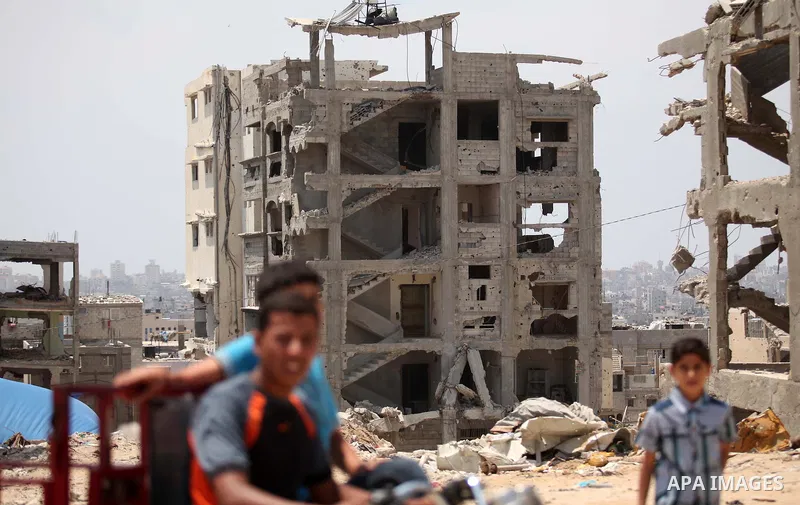 The rubbles of houses, which were destroyed during the 50-day war between Israel and Hamas militants in the summer of 2014, in the Al-Shaaf neighbourhood, on June 06, 2015. Qatar's ambassador Mohammed al-Emadi announced...