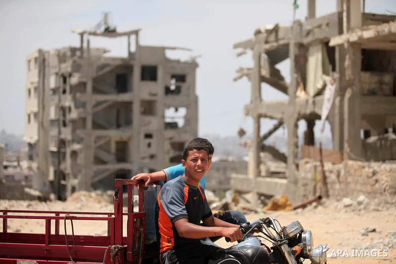 The rubbles of houses, which were destroyed during the 50-day war between Israel and Hamas militants in the summer of 2014, in the Al-Shaaf neighbourhood, on June 06, 2015. Qatar's ambassador Mohammed al-Emadi announced...