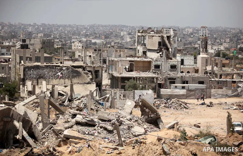 The rubbles of houses, which were destroyed during the 50-day war between Israel and Hamas militants in the summer of 2014, in the Al-Shaaf neighbourhood, on June 06, 2015. Qatar's ambassador Mohammed al-Emadi announced...