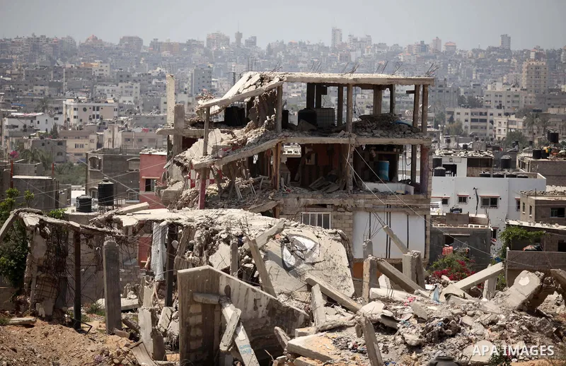 The rubbles of houses, which were destroyed during the 50-day war between Israel and Hamas militants in the summer of 2014, in the Al-Shaaf neighbourhood, on June 06, 2015. Qatar's ambassador Mohammed al-Emadi announced...
