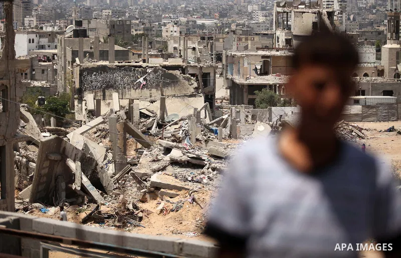 The rubbles of houses, which were destroyed during the 50-day war between Israel and Hamas militants in the summer of 2014, in the Al-Shaaf neighbourhood, on June 06, 2015. Qatar's ambassador Mohammed al-Emadi announced...