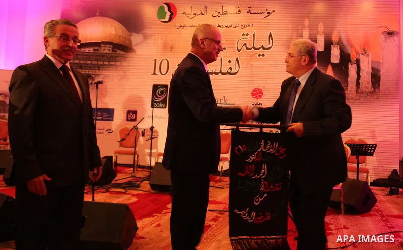 Palestinian Prime Minister Rami Hamdallah attends his honor ceremony in Amman on June 06, 2015. Photo by Prime Minister Office