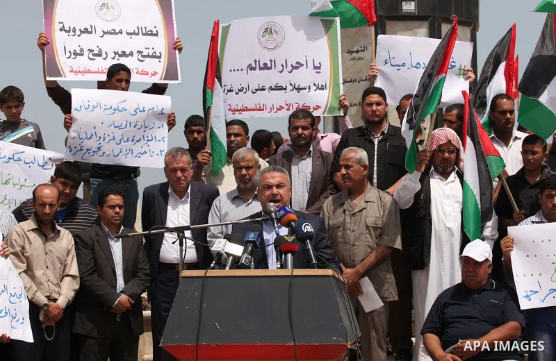 Senior Hamas leader Ismail Radwan speaks during a protest demanding for the opening of a waterway, reconstruction of houses, and to break the siege at the Gaza seaport on March 07, 2015. Photo by Ashraf Amra