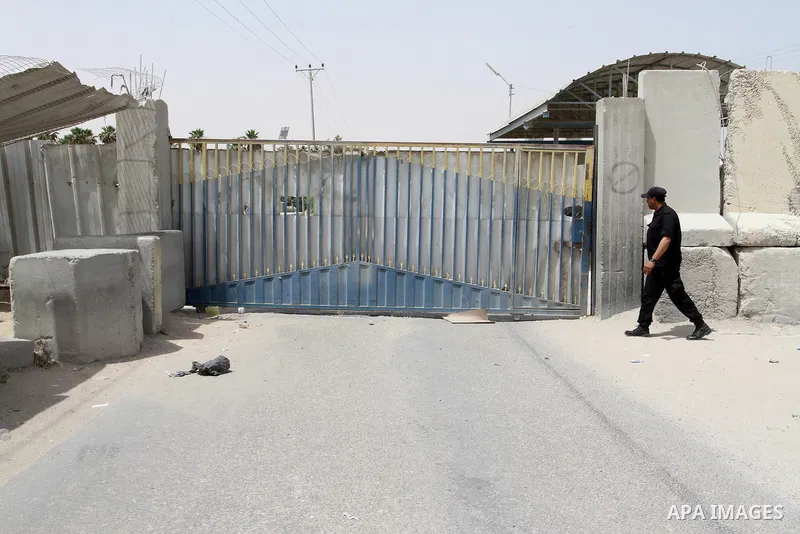 A Palestinian security officer walks past the gate under Palestinian control at the Kerem Shalom crossing between Israel and the southern Gaza Strip, south of Rafah on June 7, 2015 after Israel closed, until further noti...