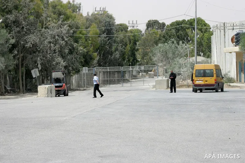 A Palestinian security officer walks past the gate under Palestinian control at the Kerem Shalom crossing between Israel and the southern Gaza Strip, south of Rafah on June 7, 2015 after Israel closed, until further noti...