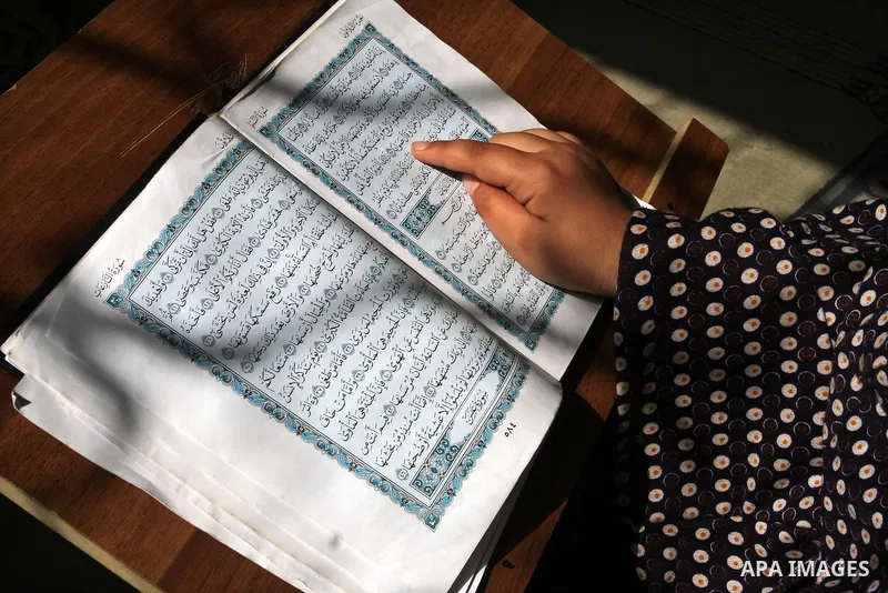 A Palestinian girl attends a Quran lesson at a Hamas-sponsored summer program, during summer vacation at a mosque in Rafah, southern Gaza Strip, on June 7, 2015. The Quran memorisation program is one of the latest activi...