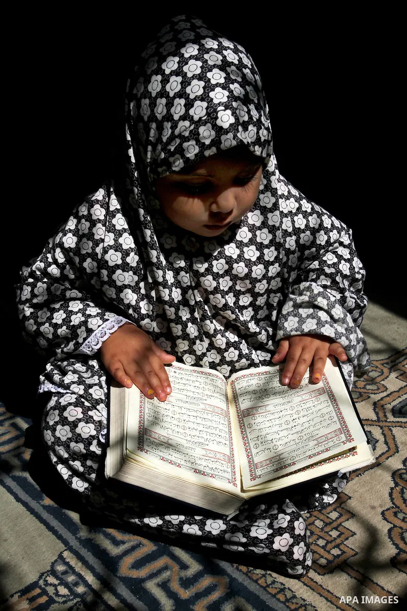 A Palestinian girl attends a Quran lesson at a Hamas-sponsored summer program, during summer vacation at a mosque in Rafah, southern Gaza Strip, on June 7, 2015. The Quran memorisation program is one of the latest activi...