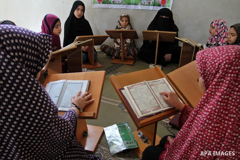 Palestinian girls attend a Quran lesson at a Hamas-sponsored summer program, during summer vacation at a mosque in Rafah, southern Gaza Strip, on June 7, 2015. The Quran memorisation program is one of the latest activiti...