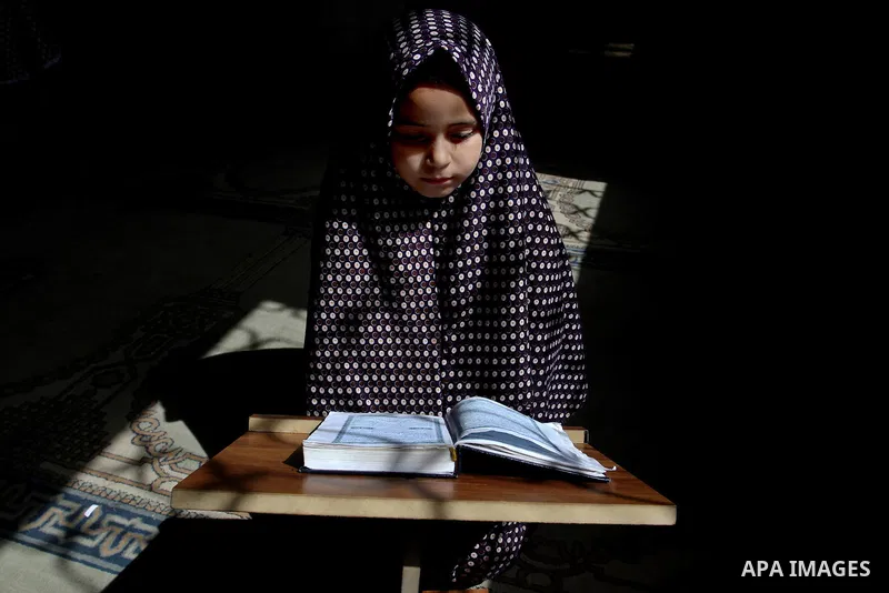 A Palestinian girl attends a Quran lesson at a Hamas-sponsored summer program, during summer vacation at a mosque in Rafah, southern Gaza Strip, on June 7, 2015. The Quran memorisation program is one of the latest activi...
