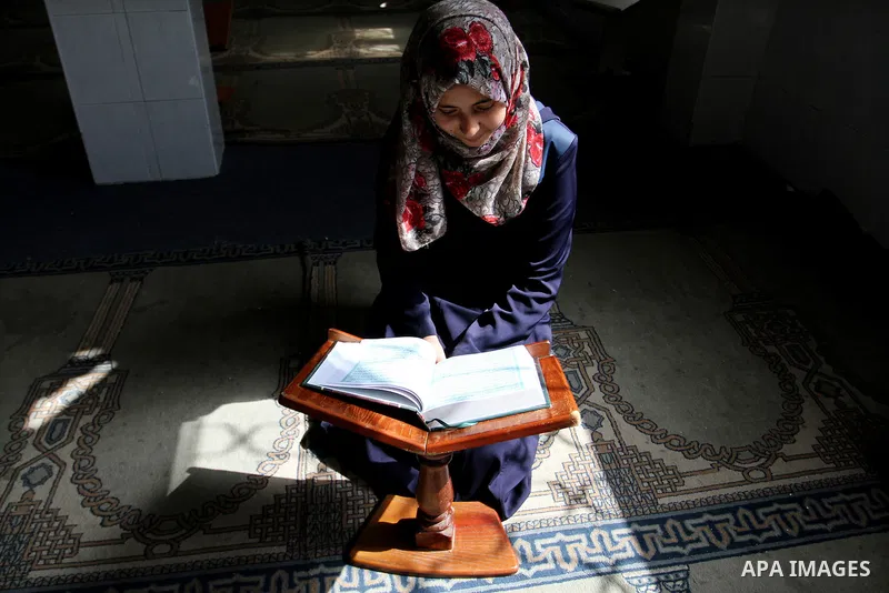 A Palestinian girl attends a Quran lesson at a Hamas-sponsored summer program, during summer vacation at a mosque in Rafah, southern Gaza Strip, on June 7, 2015. The Quran memorisation program is one of the latest activi...