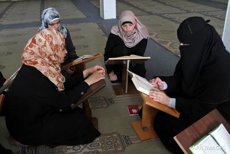 Palestinian girls attend a Quran lesson at a Hamas-sponsored summer program, during summer vacation at a mosque in Rafah, southern Gaza Strip, on June 7, 2015. The Quran memorisation program is one of the latest activiti...