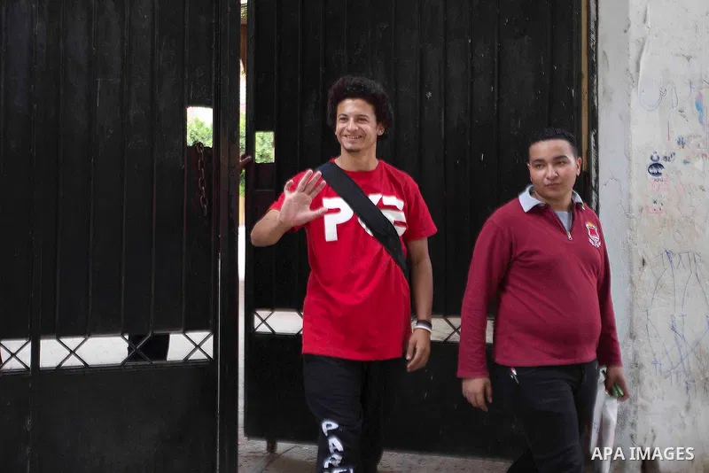 Egyptian students walk outside their school following the final high school exams known as ''Tawjihi'', in Cairo on June 7, 2015. The nationwide Arabic exam of Egypt's general secondary certificate was leaked online Sund...