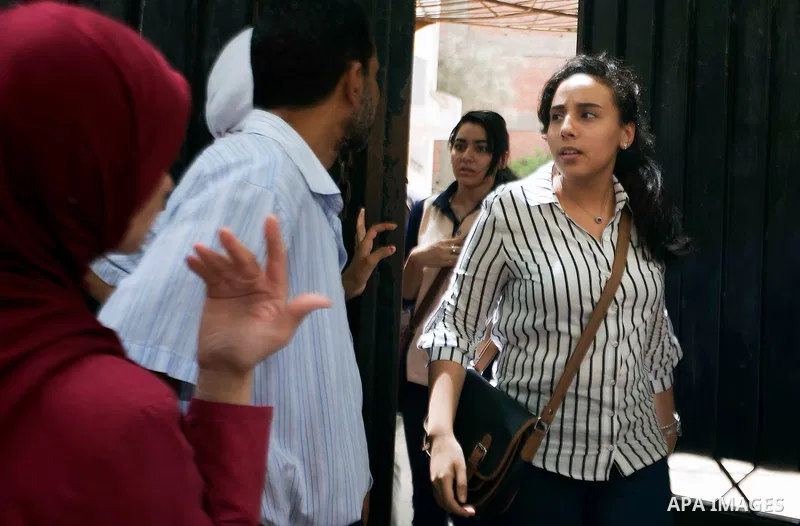 Egyptian students walk outside their school following the final high school exams known as ''Tawjihi'', in Cairo on June 7, 2015. The nationwide Arabic exam of Egypt's general secondary certificate was leaked online Sund...
