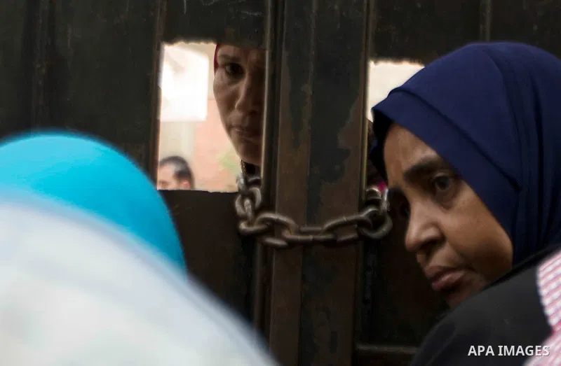 Relatvies of Egyptian students wait outside a school during the final high school exams known as ''Tawjihi'', in Cairo on June 7, 2015. The nationwide Arabic exam of Egypt's general secondary certificate was leaked onlin...