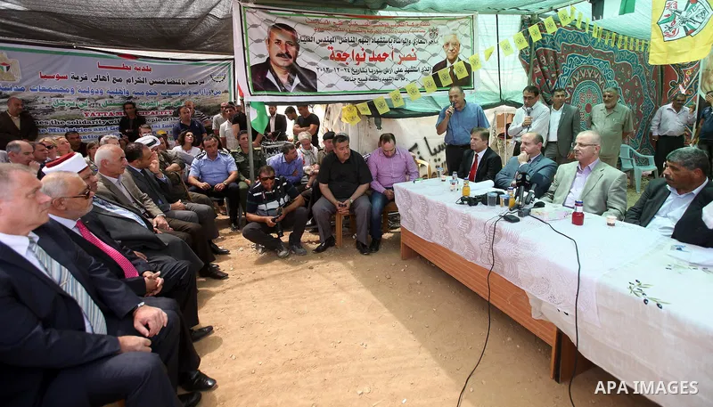 Palestinian prime minister Rami Hamadallah visits the village of Susia outside the West Bank village of Yatta, on June 8, 2015. Photo by Prime Minister Office