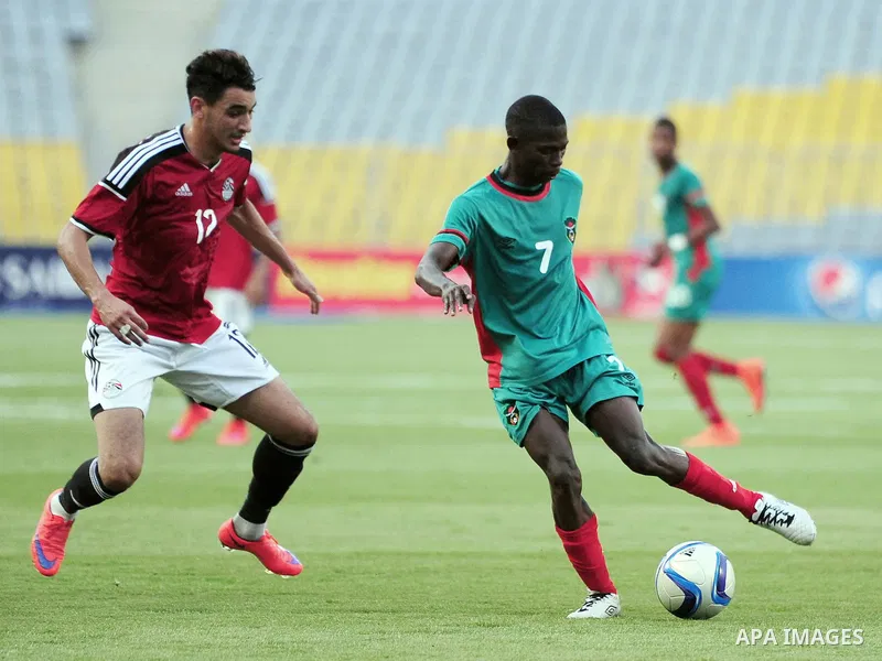 Players of Egyptian national team play against Malawi national team during a friendly match in Alexandria on June 8, 2015. Photo by Stringer