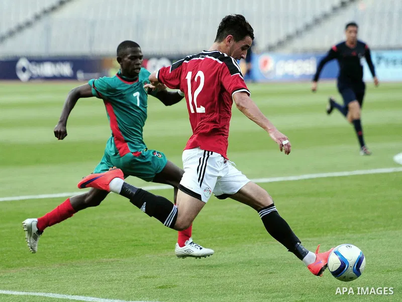 Players of Egyptian national team play against Malawi national team during a friendly match in Alexandria on June 8, 2015. Photo by Stringer