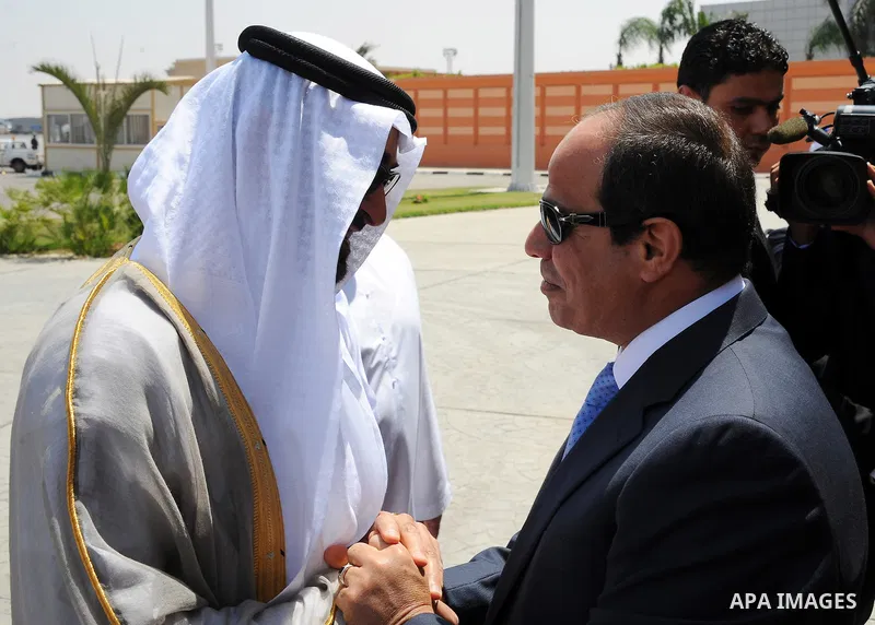 Egyptian President Abdel Fattah al-Sisi (R) welcomes UAE's Foreign Minister Sheikh Abdullah bin Zayed bin Sultan Al Nahyan upon his arrival for an official visit on June 9, 2015 in the Egyptian capital, Cairo. Photo by E...