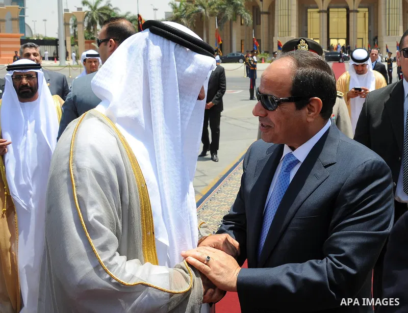 Egyptian President Abdel Fattah al-Sisi (R) welcomes UAE's Foreign Minister Sheikh Abdullah bin Zayed bin Sultan Al Nahyan upon his arrival for an official visit on June 9, 2015 in the Egyptian capital, Cairo. Photo by E...