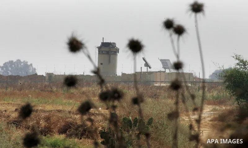 Israeli bulldozers work along a barbed wire fence that separates Khan Yunis in the southern Gaza Strip and the Israeli border, on June 10, 2015. Israel is to reopen border crossings to and from the Gaza Strip the coming...