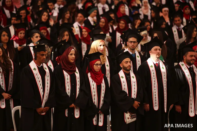 Palestinian students attend their graduation ceremony at the Birzeit University near the West Bank city of Ramallah, June 12, 2015. Photo by Shadi Hatem