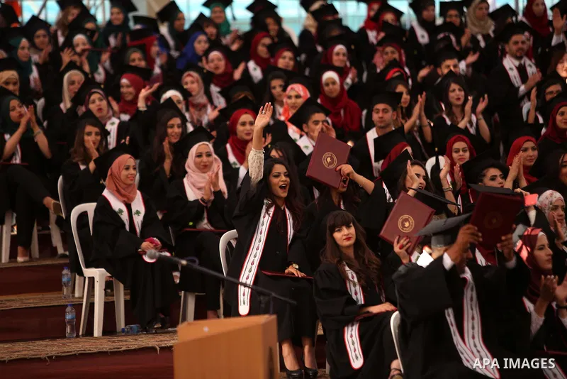 Palestinian students attend their graduation ceremony at the Birzeit University near the West Bank city of Ramallah, June 12, 2015. Photo by Shadi Hatem