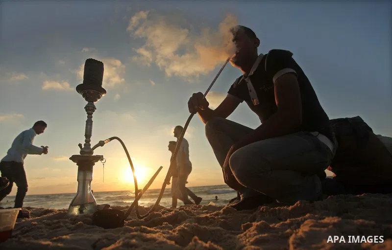 Palestinians enjoy a day at the beach of the Mediterranean Sea on the coast of Gaza City, on June 12, 2015. Photo by Ashraf Amra