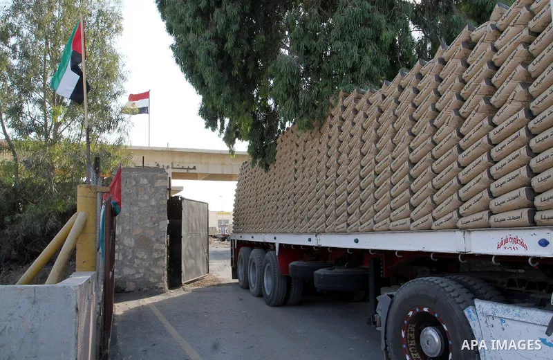 A truck loaded with cement enters the Gaza Strip from Egypt through the Rafah border crossing in southern Gaza Strip, on June 13, 2015. Egyptian authorities for the first time since the expulsion of Mohammed Morsi of the...