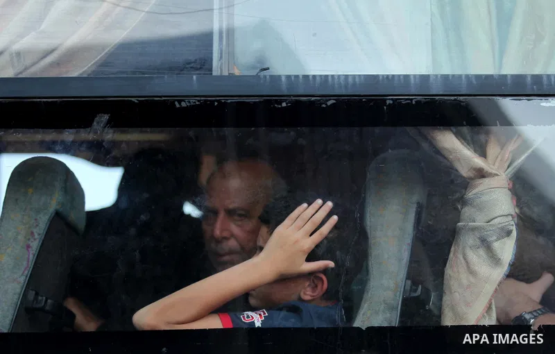 Palestinians gather at the Rafah border crossing in the southern Gaza Strip, as they await permission to enter Egypt on June 14, 2015. Egypt is due to reopen its Rafah border crossing with Gaza for three days. The Rafah...