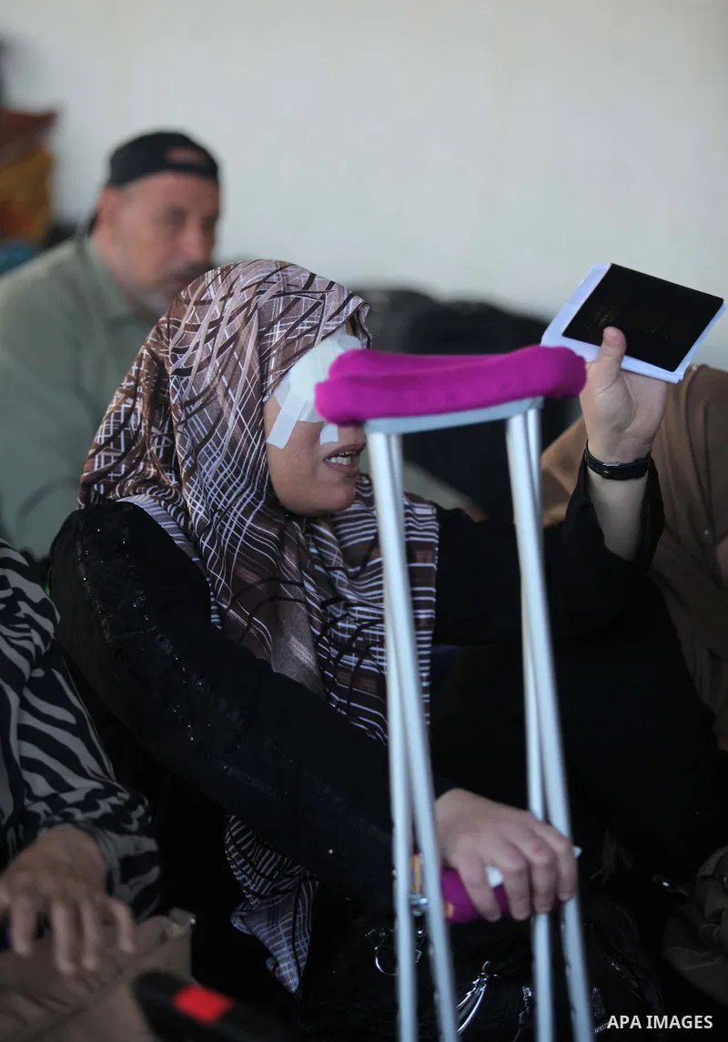 Palestinians gather at the Rafah border crossing in the southern Gaza Strip, as they await permission to enter Egypt on June 14, 2015. Egypt is due to reopen its Rafah border crossing with Gaza for three days. The Rafah...