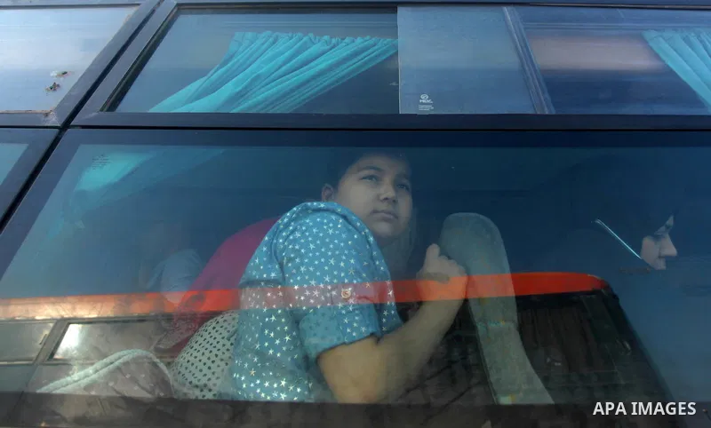Palestinians gather at the Rafah border crossing in the southern Gaza Strip, as they await permission to enter Egypt on June 14, 2015. Egypt is due to reopen its Rafah border crossing with Gaza for three days. The Rafah...