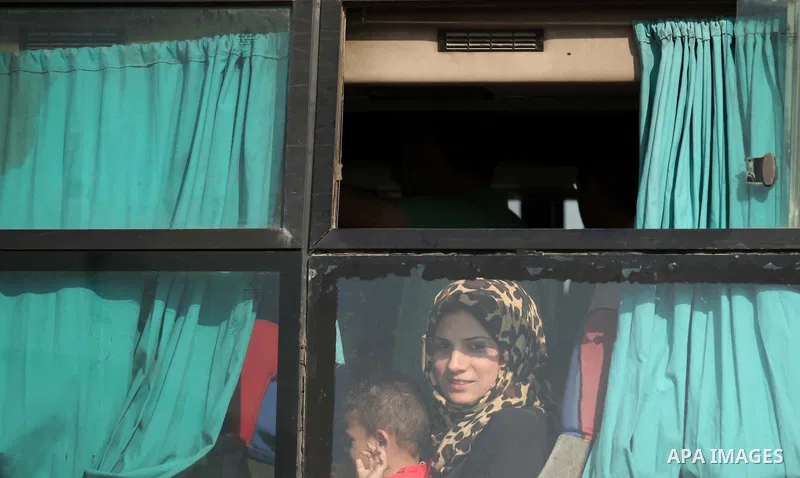 Palestinians gather at the Rafah border crossing in the southern Gaza Strip, as they await permission to enter Egypt on June 14, 2015. Egypt is due to reopen its Rafah border crossing with Gaza for three days. The Rafah...