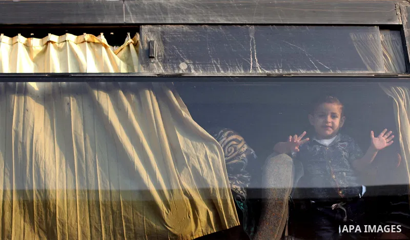 Palestinians wait for travel permits to cross into Egypt at the Rafah border crossing between Egypt and southern Gaza Strip June 15, 2015. Egypt opened the Rafah border crossing on Saturday to allow Palestinians to trave...