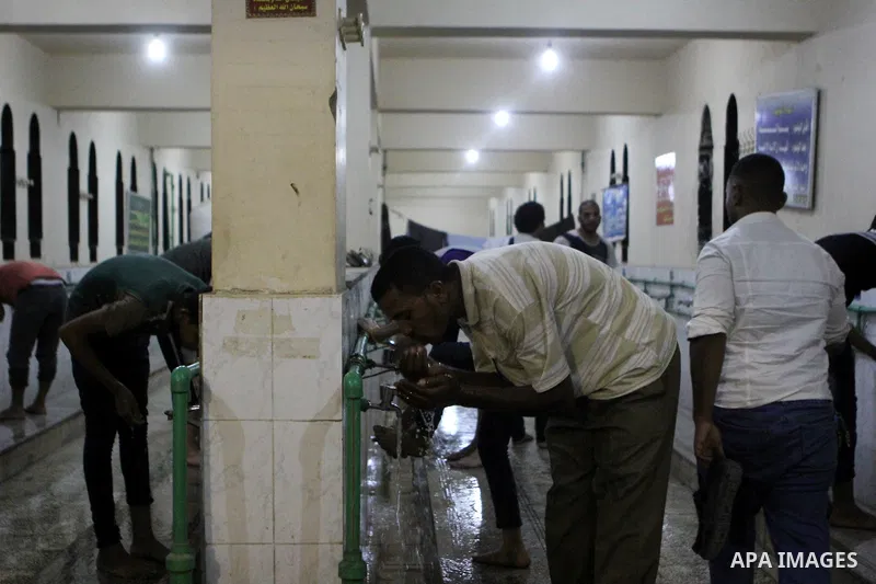 Egyptian worshipers perform ablution before an evening prayer "Taraweeh", at Amr Ibn al-Aas mosque, in Cairo on June 17, 2015. Millions of Muslims around the world will mark the start of Ramadan on Thursday June 18, a mo...