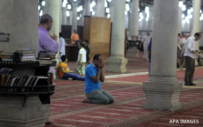 Egyptian worshipers perform take part in an evening prayer "Taraweeh", at Amr Ibn al-Aas mosque, in Cairo on June 17, 2015. Millions of Muslims around the world will mark the start of Ramadan on Thursday June 18, a month...
