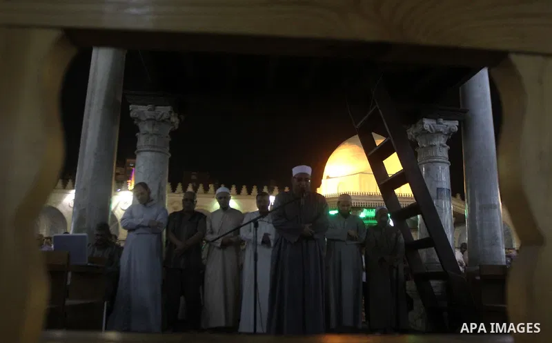 Egyptian worshipers perform take part in an evening prayer "Taraweeh", at Amr Ibn al-Aas mosque, in Cairo on June 17, 2015. Millions of Muslims around the world will mark the start of Ramadan on Thursday June 18, a month...