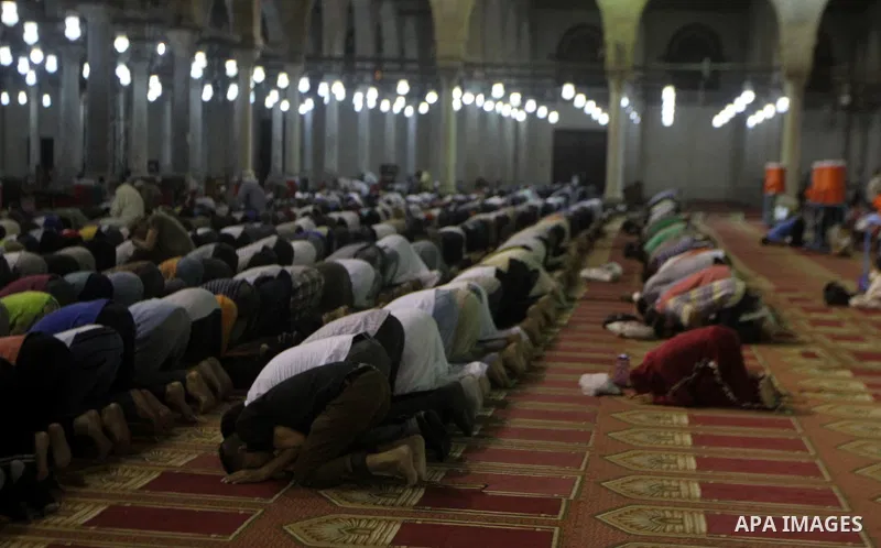 Egyptian worshipers perform take part in an evening prayer "Taraweeh", at Amr Ibn al-Aas mosque, in Cairo on June 17, 2015. Millions of Muslims around the world will mark the start of Ramadan on Thursday June 18, a month...
