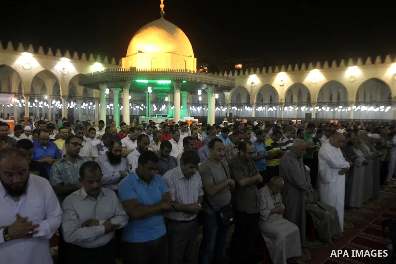 Egyptian worshipers perform take part in an evening prayer "Taraweeh", at Amr Ibn al-Aas mosque, in Cairo on June 17, 2015. Millions of Muslims around the world will mark the start of Ramadan on Thursday June 18, a month...