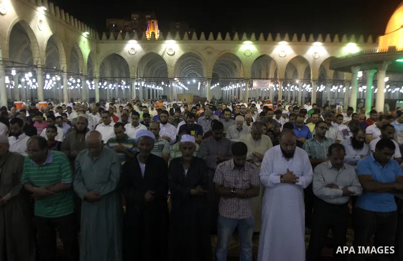 Egyptian worshipers perform take part in an evening prayer "Taraweeh", at Amr Ibn al-Aas mosque, in Cairo on June 17, 2015. Millions of Muslims around the world will mark the start of Ramadan on Thursday June 18, a month...